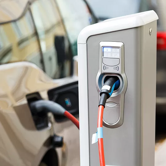 Home EV Charging station with electric vehicle plugged in